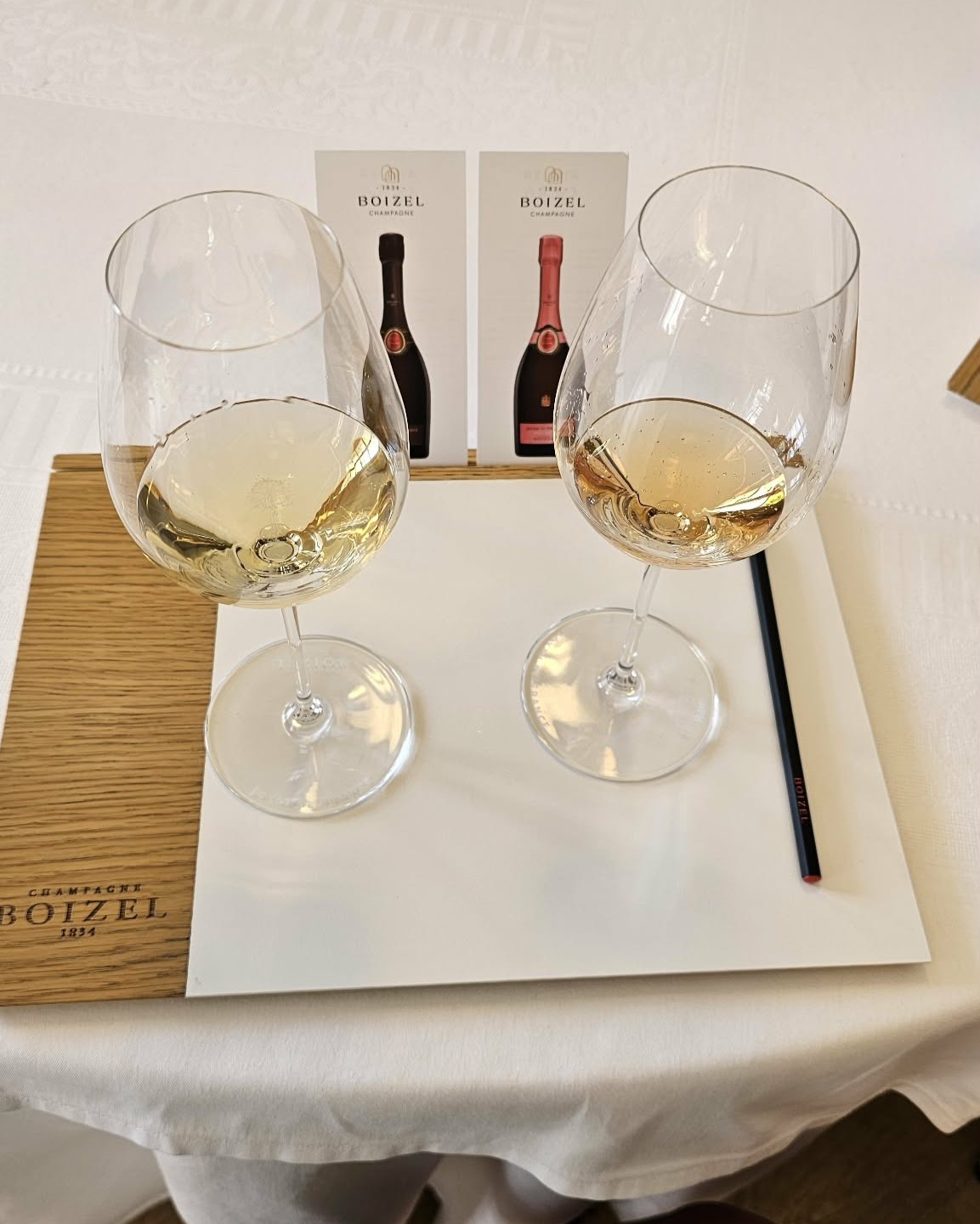 Two glasses of Boizel Champagne, white and rosé, set for a tasting on the Joyau visit in Épernay